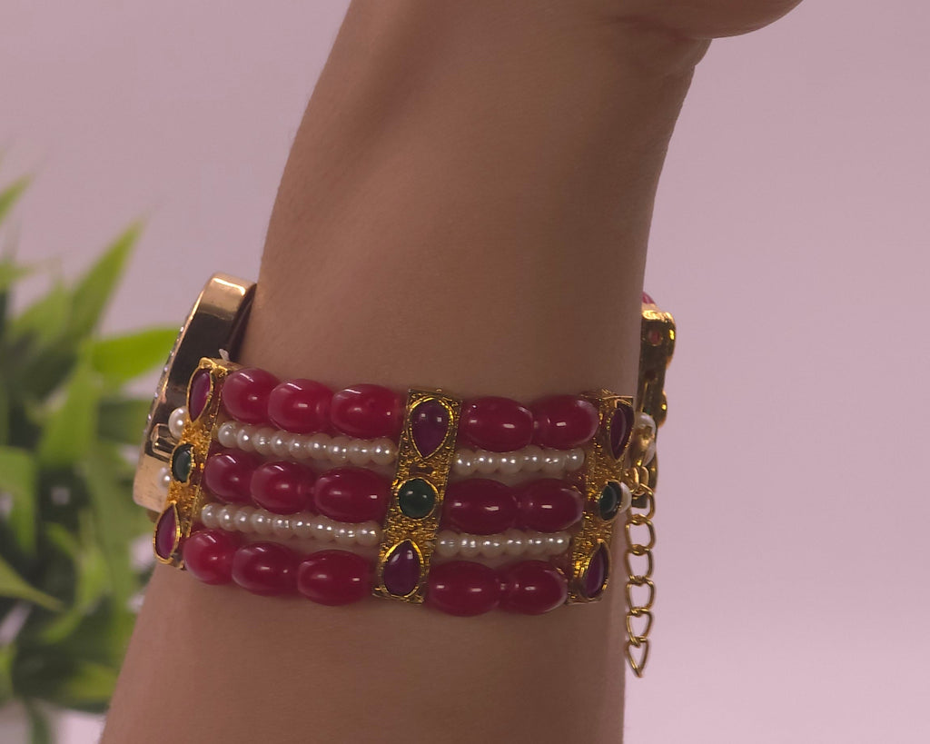 Watch with red beads
