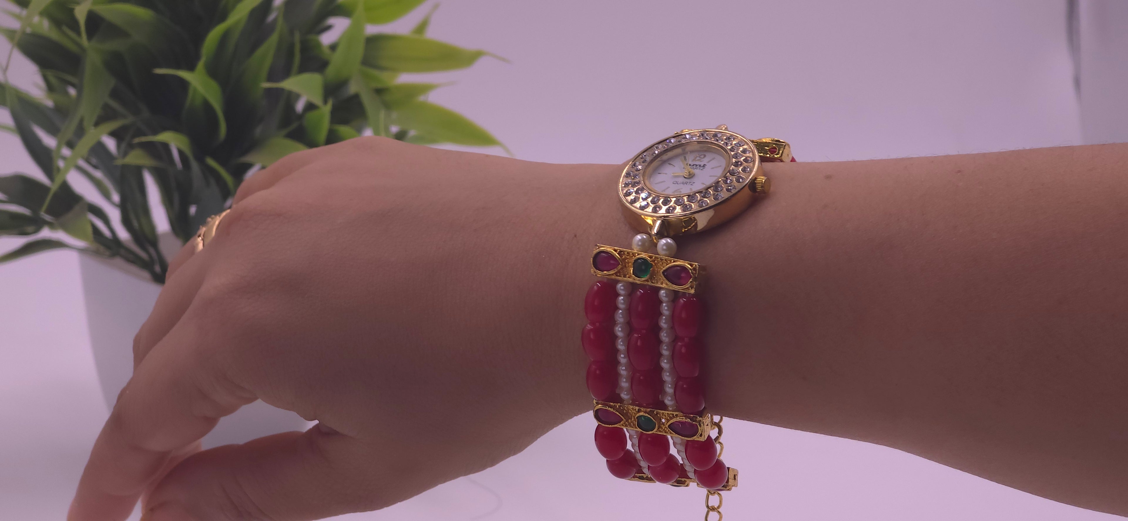 Watch with red beads