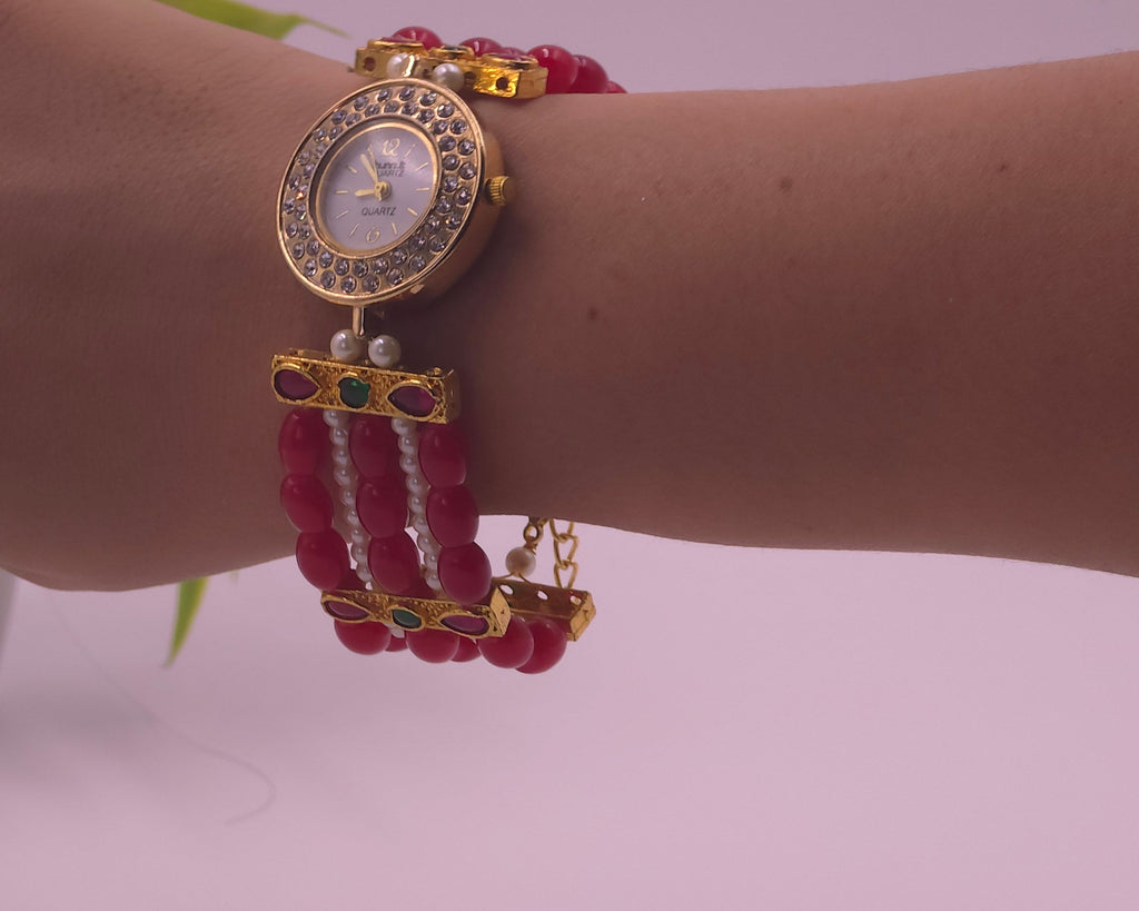 Watch with red beads