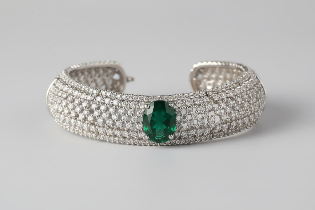 White diamond necklace with green gemstone
