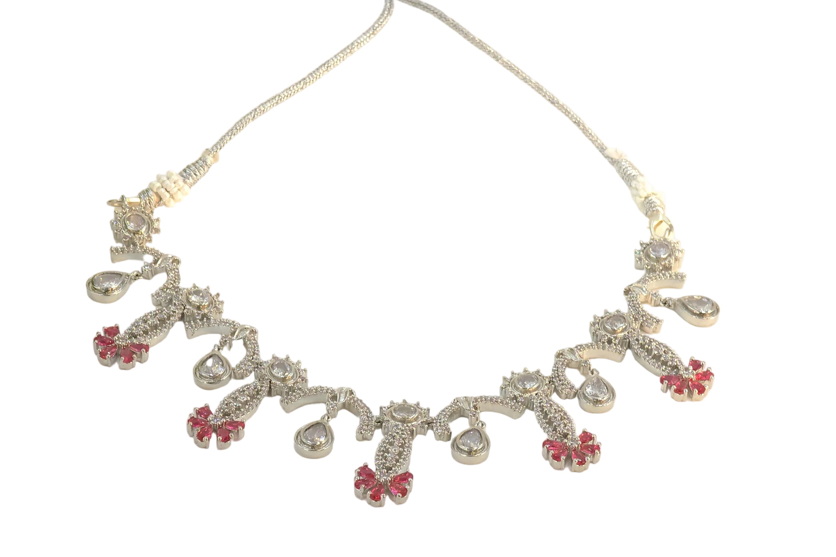 Silver necklace with red accents on a white background