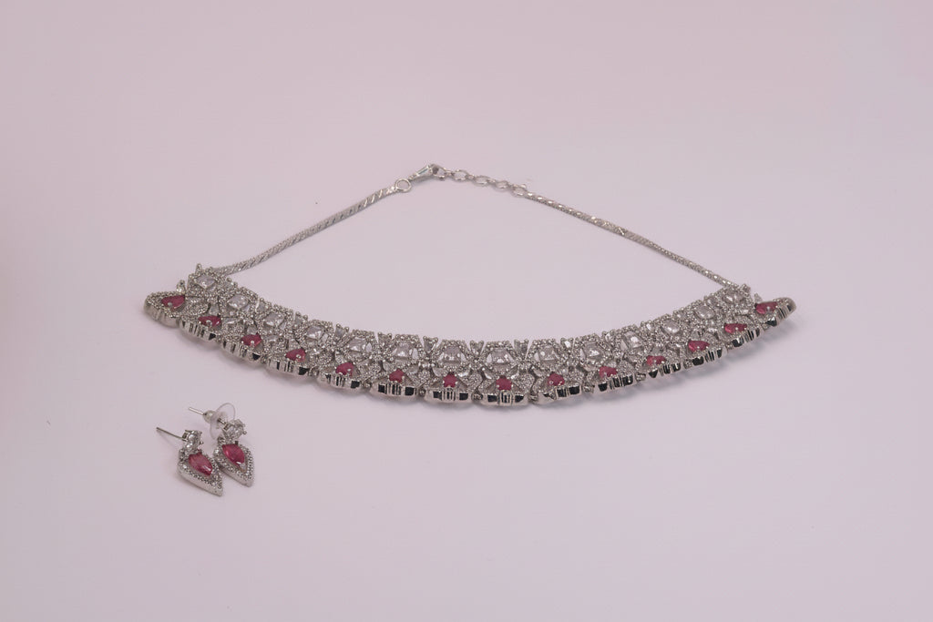 White ad with heart shaped pink stone