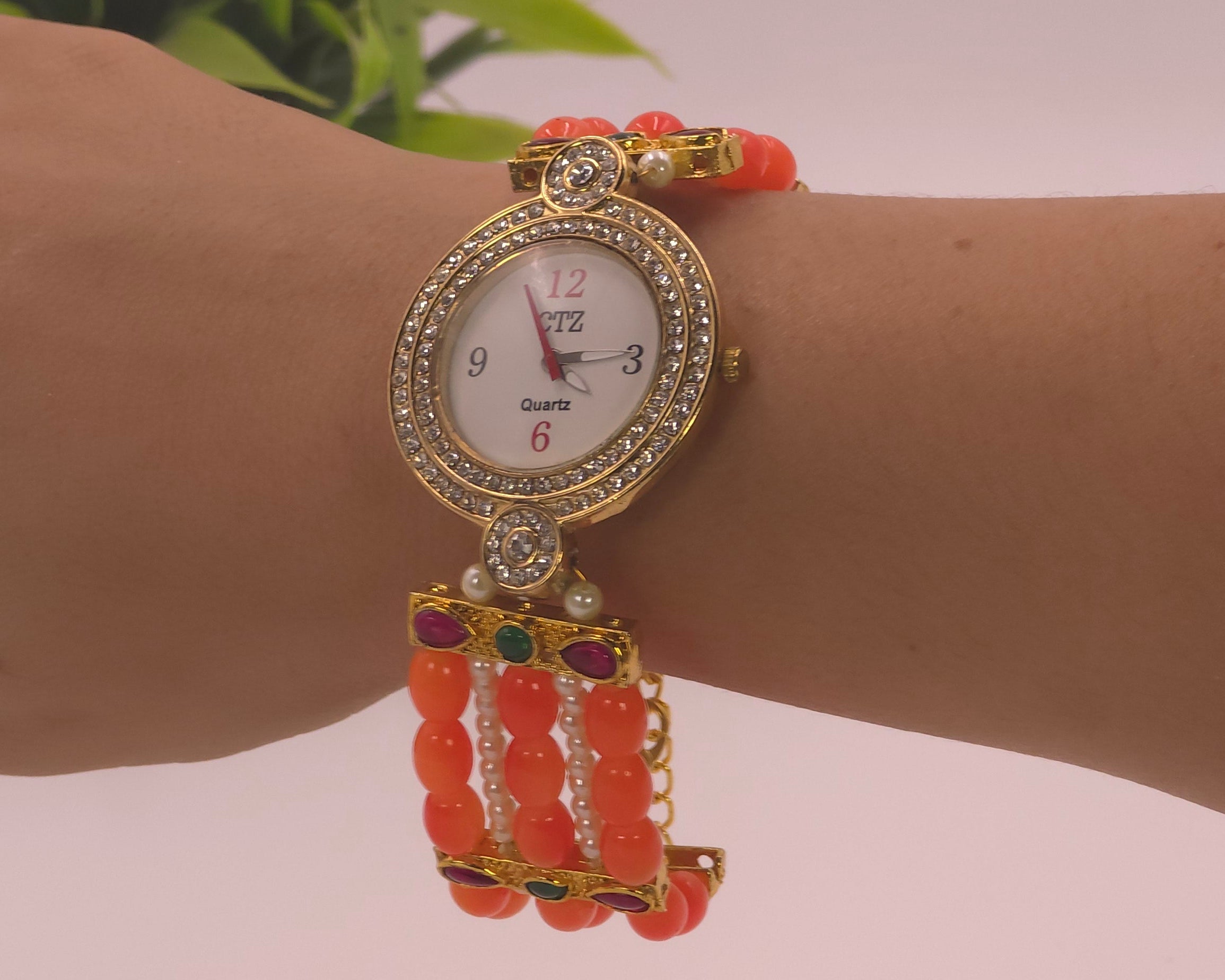 Watch with orange beads